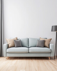 Soft blue sofa with decorative pillows in a modern living room, accentuated by natural light