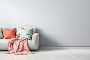 Cozy living room with a modern couch adorned with colorful pillows and a soft blanket