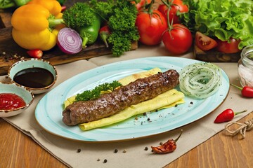 Minced beef sausage, kebab on a plate. Restaurant, Cafe, lunch, dinner.