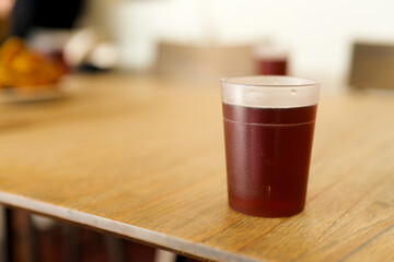 glass of beer on wooden table