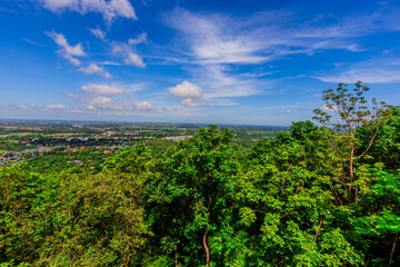 Obraz premium Background of the tourist attraction on the top of Suthep 2 mountain in Phitsanulok, Thailand, Khao Samo Khlang Pagoda, can see the beautiful scenery of mountains and rice fields.
