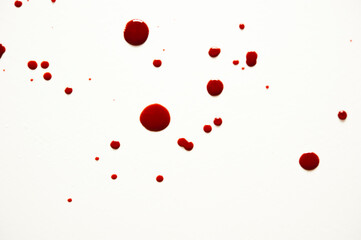 blood drops on a white surface