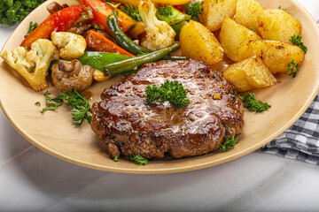 Roasted beef steak with potato