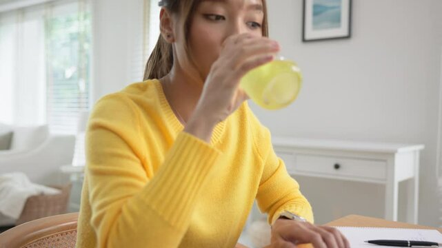 Happy fresh asia people young adult woman take skin care detox pill folic iron drinking diet zinc vit c d boost water for worker enjoy relax work at home desk. Herbal juice glass refresh immune system