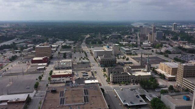 Tulsa, Oklahoma, USA - June 25, 2023: Afternoon sun shines on historic buildings of downtown Tulsa.