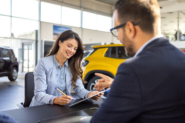 Car dealership, documents and people with handshake in showroom and contract, consulting and...