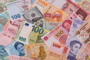 Obraz premium Many banknotes from different countries of the world of different denominations