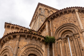 Architectural details of the romanesque Collegiate Church of Santillana or Colegiata de Santa...