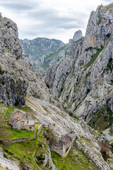 An abandoned ruined farmer house in the picturesque Cares gorge, Picos de Europa mountains in Asturias, Spain
