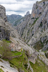An abandoned ruined farmer house in the picturesque Cares gorge, Picos de Europa mountains in Asturias, Spain