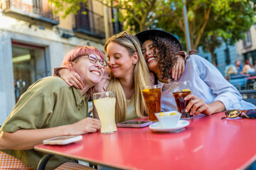 Friends reunited drinking beverages on an outdoor bar