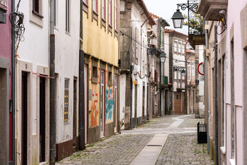 Picturesque narrow alley with small residential houses in the town center of Viana do Castelo