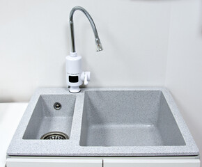 Chrome faucet with modern sink