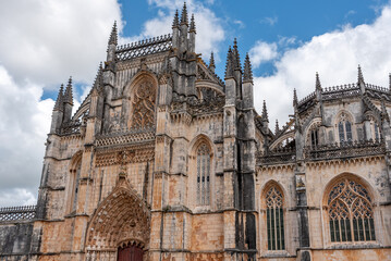 Fototapeta premium Picturesque main portal of medieval Santa Maria da Vitoria monastery church in Batalha, a manueline gothic masterpiece