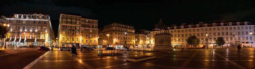 Panorama of Figueira square with equestrian statue of Joao I in Lisbon at night