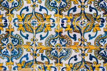 Traditional old alicatado ceramic tiles in a building in Evora