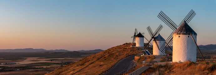 Iconic historic windmills in Consuegra during sunrise, known from Cervantes novel Don Quichotte