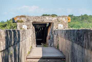 Water canal of famous Roman aqueduct Pont du Gard in France