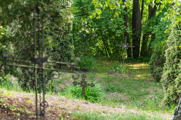 Detail of metal Christian cross in a cemetery