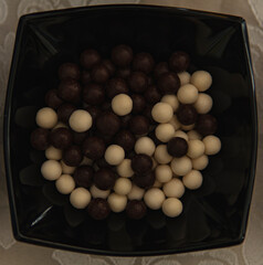 Detail of sweets formed into black and white balls