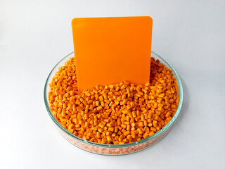 cold cutting type masterbatch granules in pantri cup, pigment coloring resin raw material plastic, isolated on white background for product catalog design profile of industrial plastic company