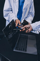 Medical team working on digital tablet healthcare doctor technology tablet using computer analyzed the results of medical reports at the hospital.