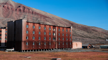 Exploring the abandoned buildings of Pyramiden in Svalbard on a clear day