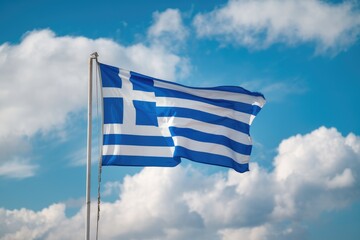 Obraz premium Greek flag waving in the wind on a sunny day