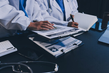 Medical team working on digital tablet healthcare doctor technology tablet using computer analyzed...