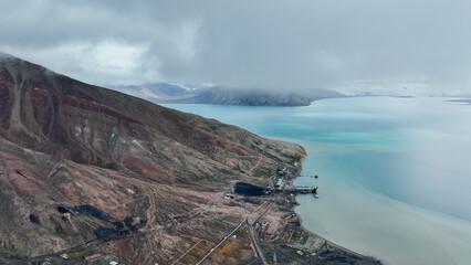 Aerial view of Pyramiden in Svalbard showcasing the bay and surrounding mountains