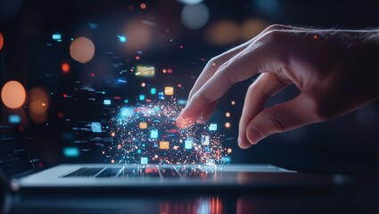 Fototapeta premium A hand extends towards a laptop, creating a vibrant explosion of digital icons and sparks, set against a dark background, conveying an atmosphere of innovation and exploration.