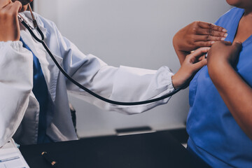 Female doctor use stethoscope to examine eldely paient heartbeat