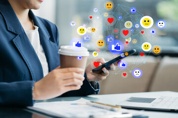 Social media icons screen of businessman with smartphone and laptop computer at office at morning...