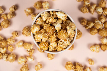 Sweet caramelized popcorn in a bucket top view