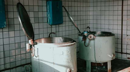 Exploring abandoned kitchen equipment in Pyramiden, Svalbard during the long polar night