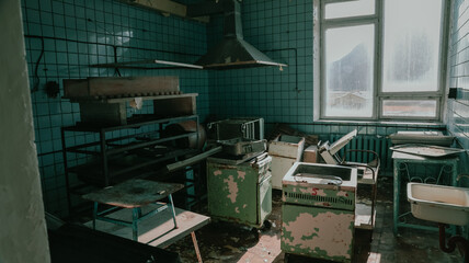 Exploring an abandoned kitchen in Pyramiden Svalbard revealing remnants of the past