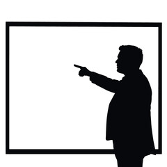 A businessman silhouette pointing towards a whiteboard