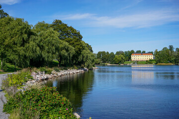 Fototapeta premium Scenic view of a lake against blue sky in Sollentuna