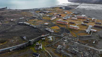 Exploring the abandoned coal mine remnants in Pyramiden, Svalbard under cloudy skies