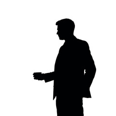 A businessman silhouette standing and drinking coffee, with one hand holding a coffee cup near his mouth