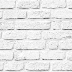 A textured white brick wall creates a clean, minimalist backdrop suitable for various design applications.