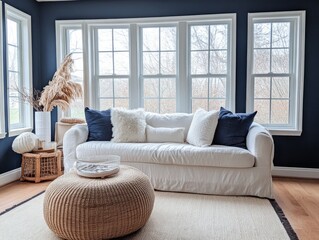 Minimalist living room with navy walls, cozy neutral decor, and warm lighting, creating a serene and inviting winter retreat