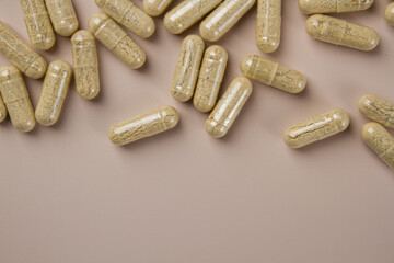 Vitamin capsules on a light background. Dietary supplements for health