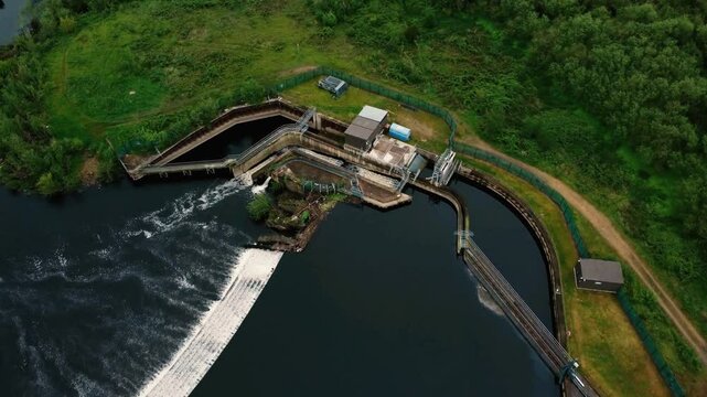 Drone fly over Kirkthorpe Hydro electricity generation plant on river Calder.