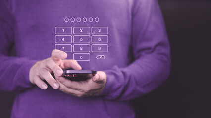 Person holds a smartphone with a digital keypad overlay, entering a passcode for security access. This image represents digital security, PIN entry, and data protection on mobile devices.