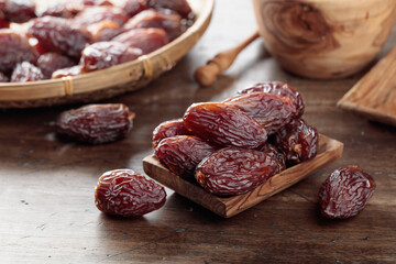 Dried dates on a old wooden table.