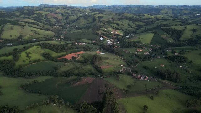 aerial view of a region rich in agriculture and waterfalls in south of Minas Gerais - Large mountain range known as Serra da Mantiqueira - Bueno Brandao, Bra