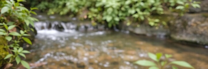 Fototapeta premium Blurred image of serene natural background with flowing water and lush green plants, scenery, garden, background