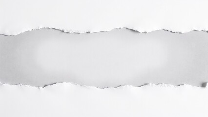 Creative paper tear revealing a smooth gray surface, adding texture and depth to artistic projects