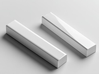 Two minimalistic white rectangular objects displayed on a smooth surface, showcasing different angles and designs, evoking a sense of simplicity and modernity.